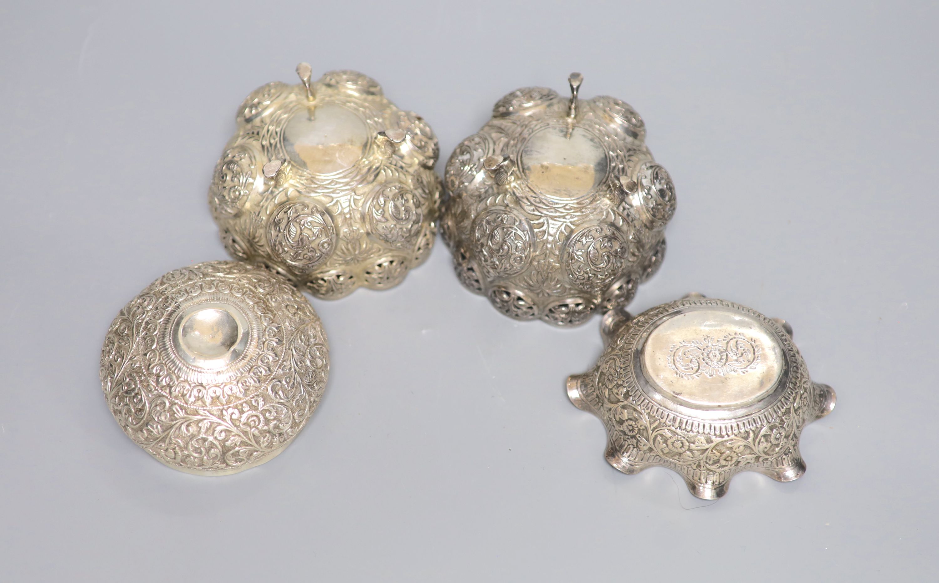 A pair of Indian white metal bowls, diameter 96mm and two similar bowls